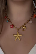 Collier bohème doré étoile de mer et dauphin - Aleca Jewelry